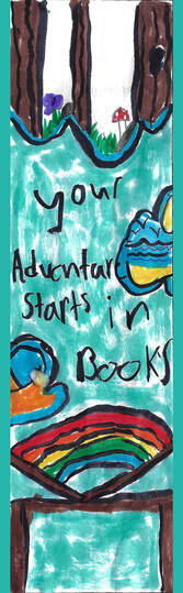 Bookmark with the following hand-drawn image in marker, from left to right: a turquoise background with a brown table with an open book on it, the book has a rainbow between the pages. the text 